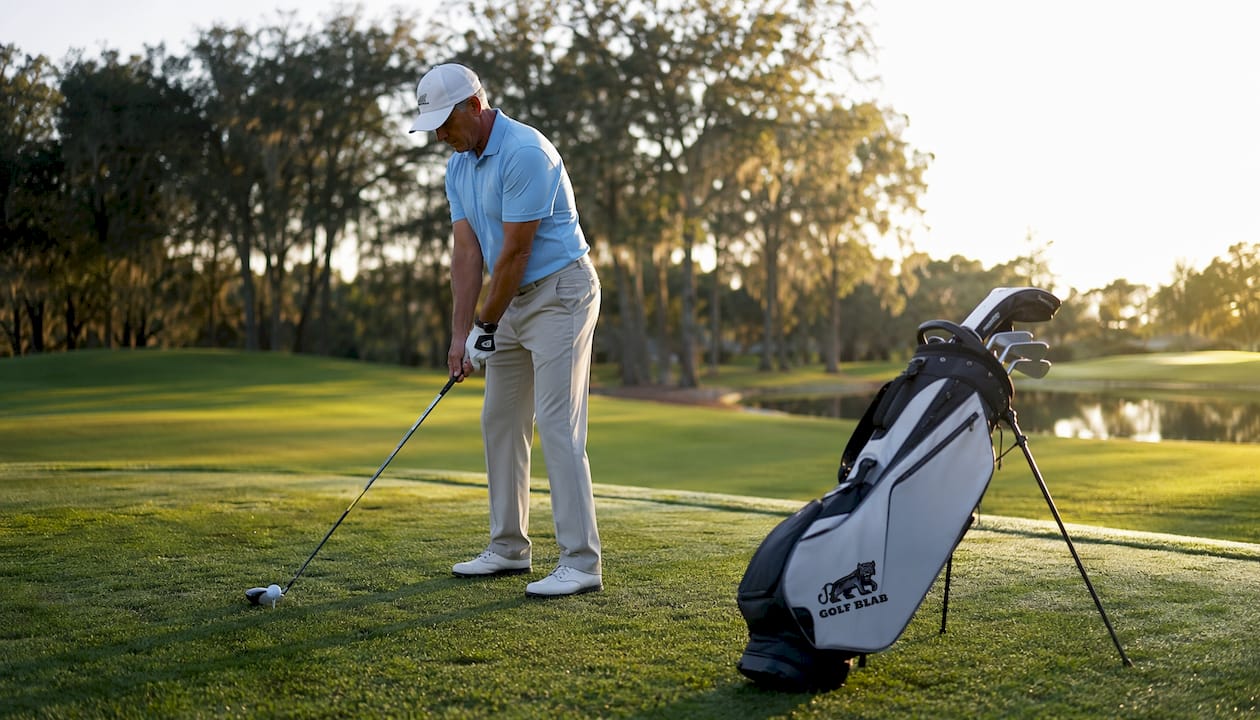 Golfer focusing mentally before shot on golf course